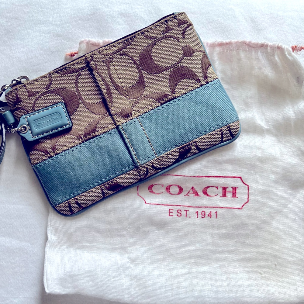 Pre-owned COACH signature canvas and blue wristlet